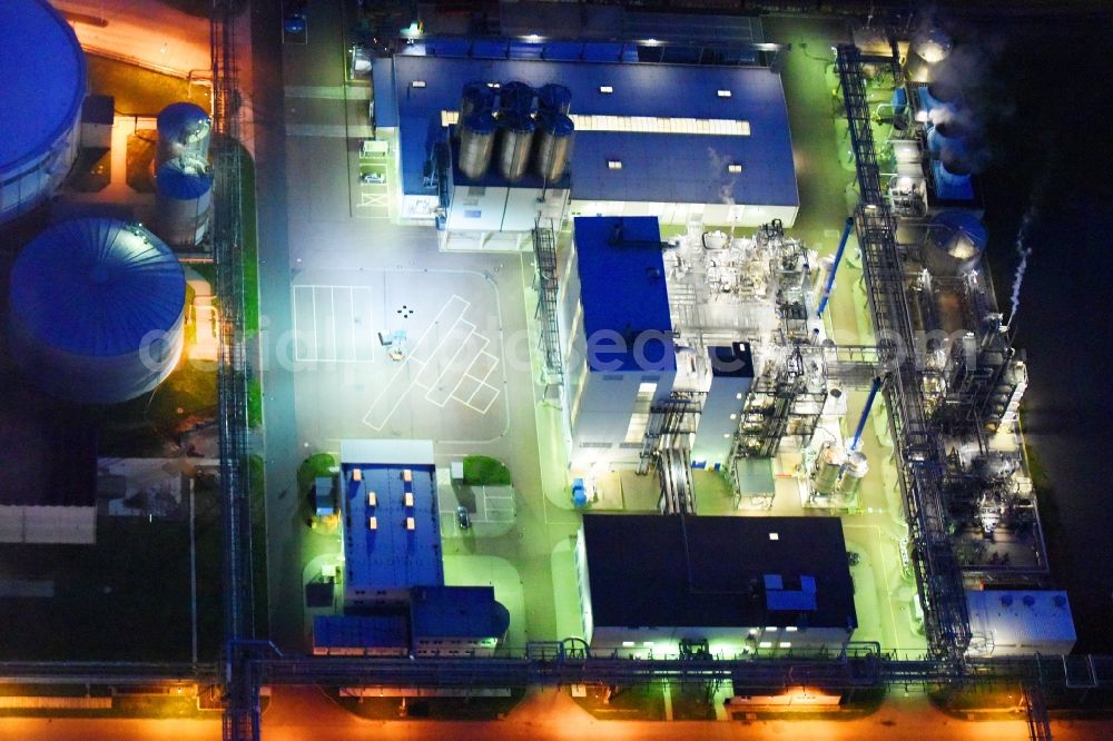 Aerial image at night Piesteritz - Night lighting refinery equipment and management systems on the factory premises of the chemical manufacturers of SKW Stickstoffwerke Piesteritz GmbH in Piesteritz in the state Saxony-Anhalt, Germany