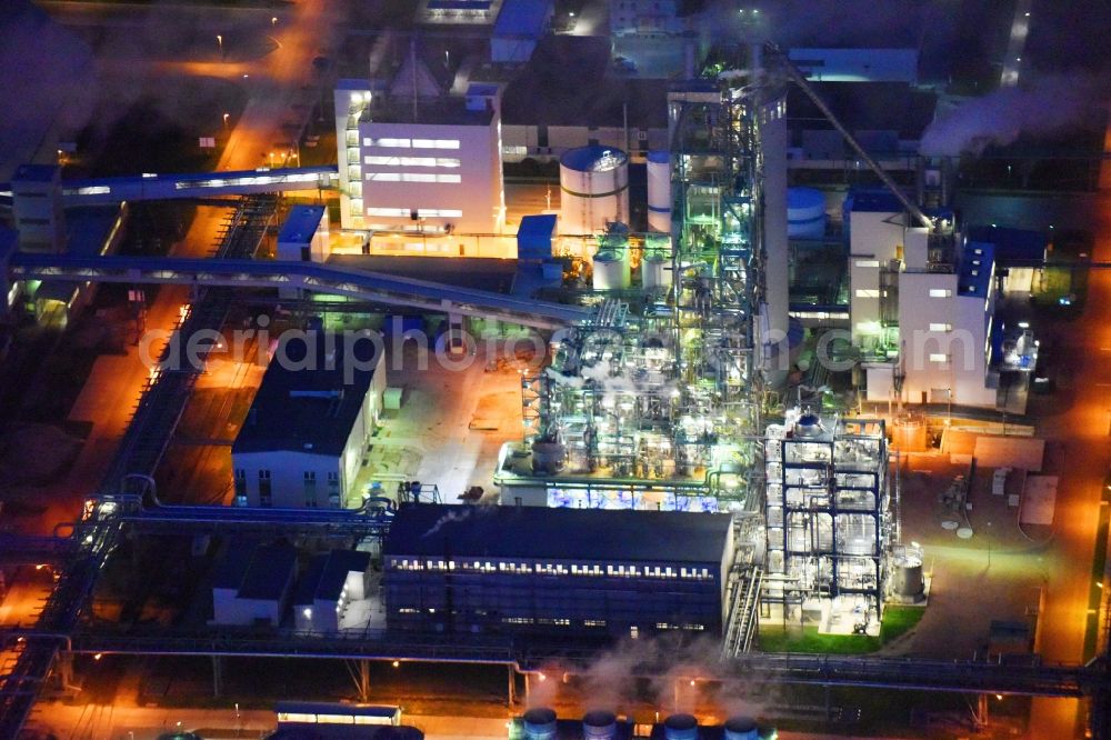 Piesteritz at night from above - Night lighting refinery equipment and management systems on the factory premises of the chemical manufacturers of SKW Stickstoffwerke Piesteritz GmbH in Piesteritz in the state Saxony-Anhalt, Germany