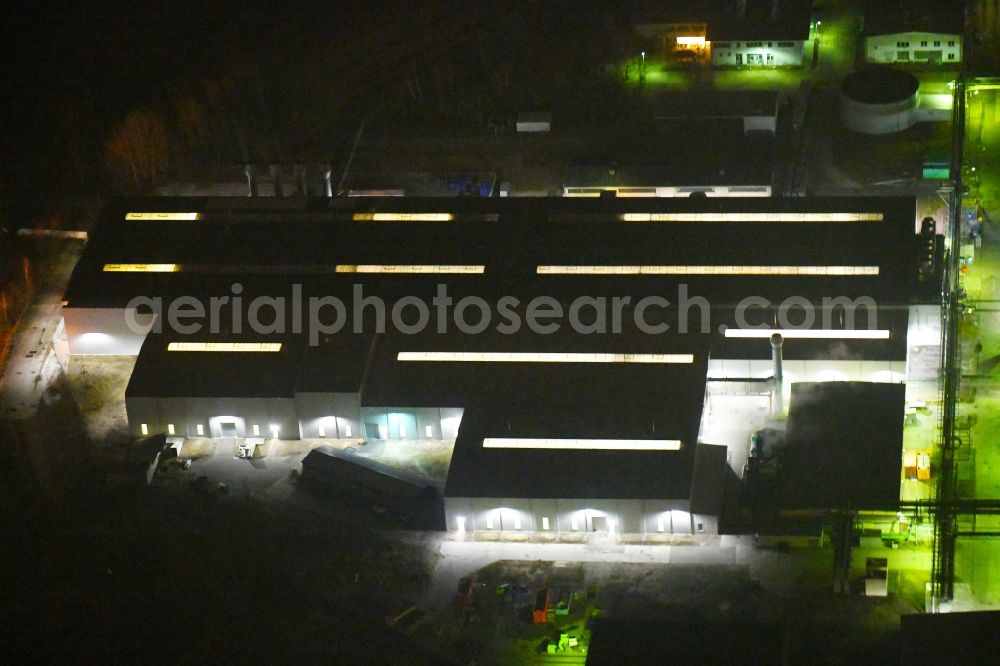 Aerial image at night Fürstenwalde/Spree - Night lighting Building and production halls on the premises of tyre1 GmbH & Co. KG - Pneumant Am Bahndonm - Reifenwerkring in Fuerstenwalde/Spree in the state Brandenburg, Germany