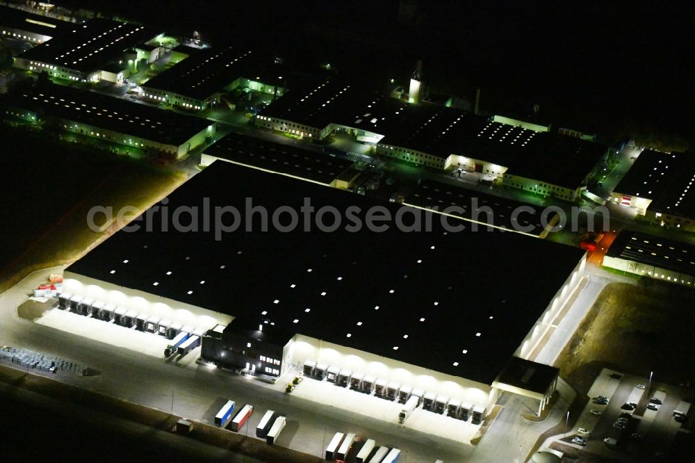 Sonneborn at night from above - Night lighting Building and production halls on the premises of VELUX Deutschland GmbH on Arzbach in Sonneborn in the state Thuringia, Germany