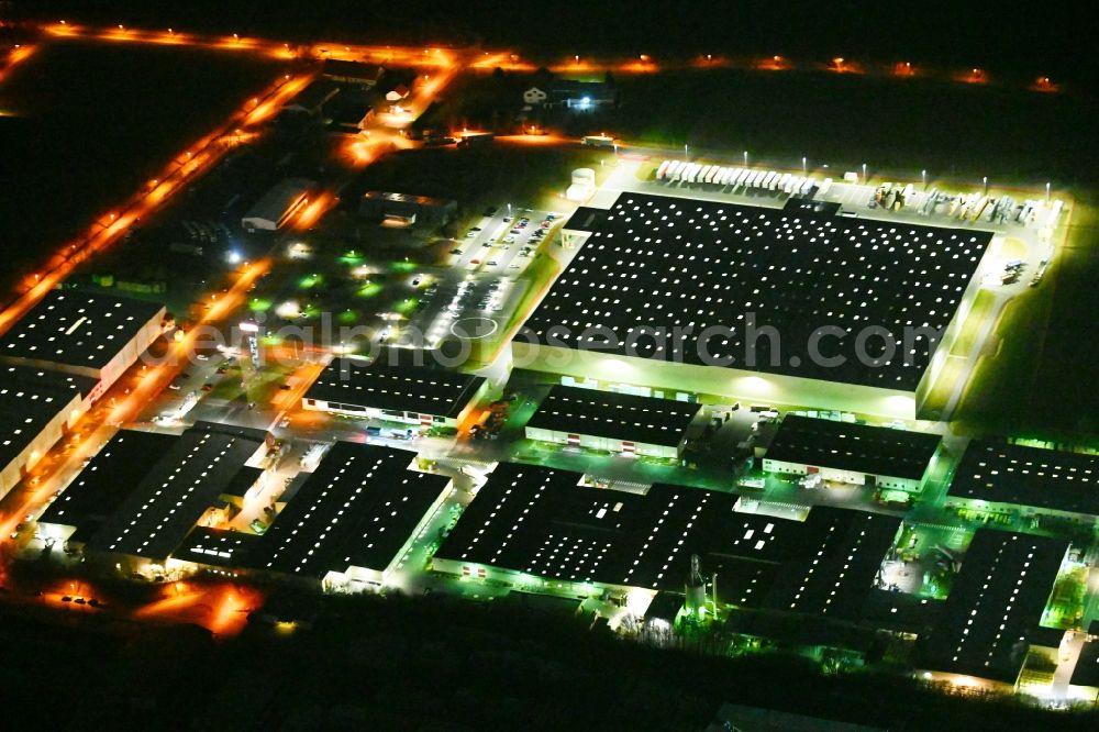 Sonneborn at night from above - Night lighting building and production halls on the premises VELUX on Arzbach in Sonneborn in the Thuringian Forest in the state Thuringia, Germany