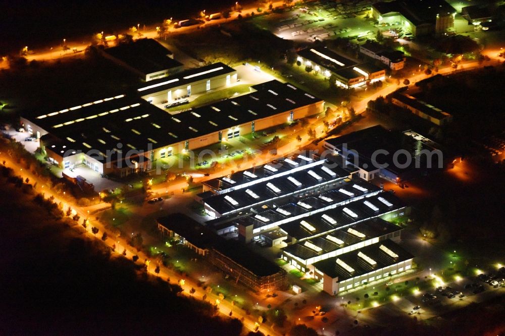 Neubrandenburg at night from above - Night lighting Building and production halls on the premises of Weber Maschinenbau GmbH on Feldmark in Neubrandenburg in the state Mecklenburg - Western Pomerania, Germany