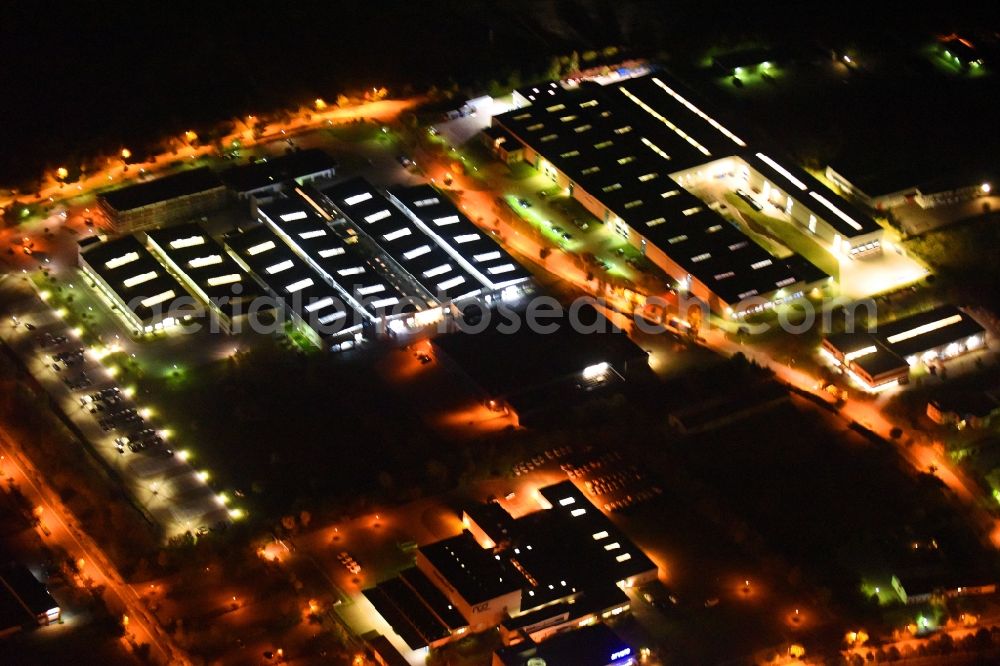 Neubrandenburg at night from above - Night lighting Building and production halls on the premises of Weber Maschinenbau GmbH on Feldmark in Neubrandenburg in the state Mecklenburg - Western Pomerania, Germany