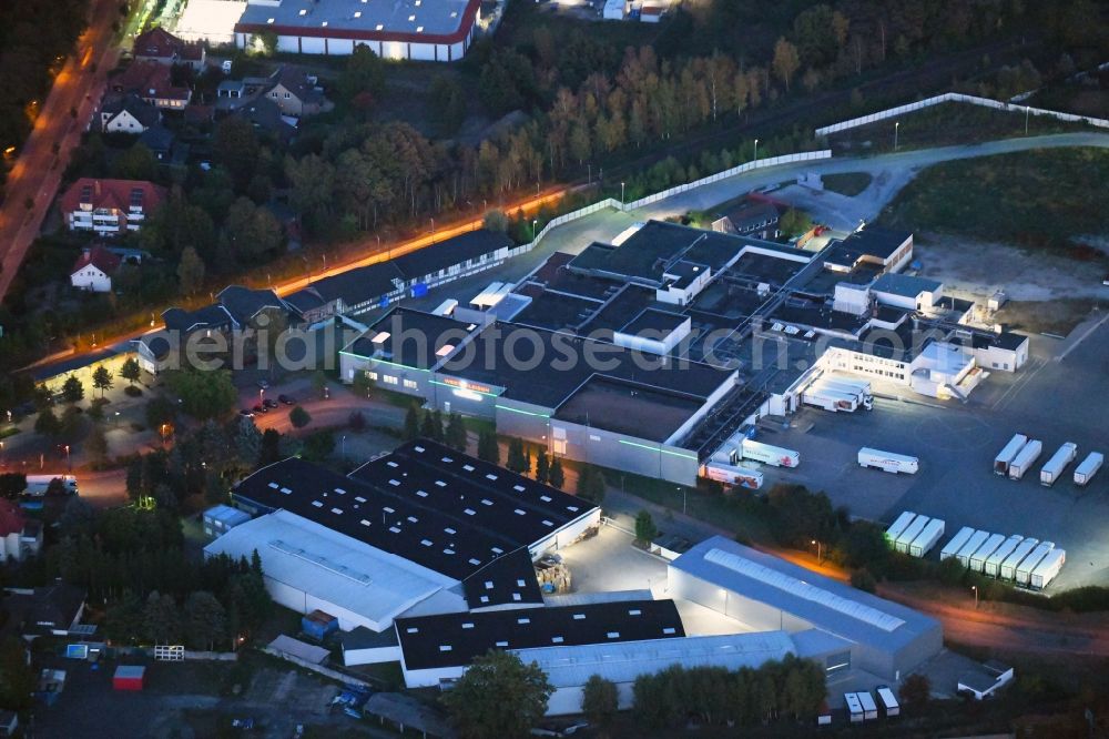 Dissen am Teutoburger Wald at night from above - Night lighting Building and production halls on the premises of Westfleisch SCE mbH in Dissen am Teutoburger Wald in the state Lower Saxony, Germany