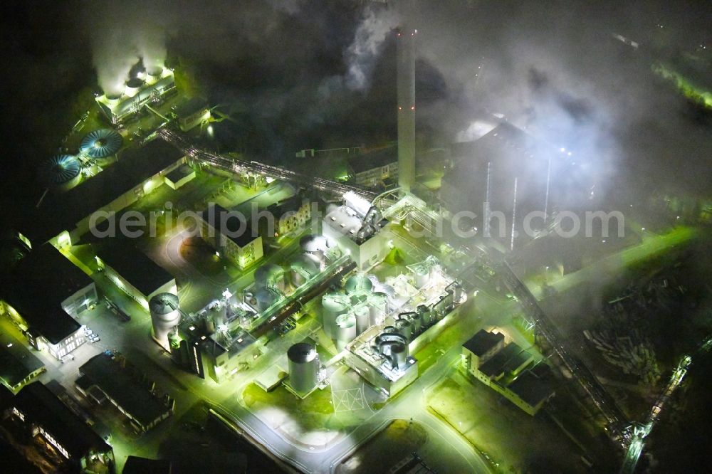 Aerial image at night Blankenstein - Night lighting Building and production halls on the premises of Zellstoff- and Papierfabrik Rosenthal GmbH on Hauptstrasse in Blankenstein in the state Thuringia, Germany