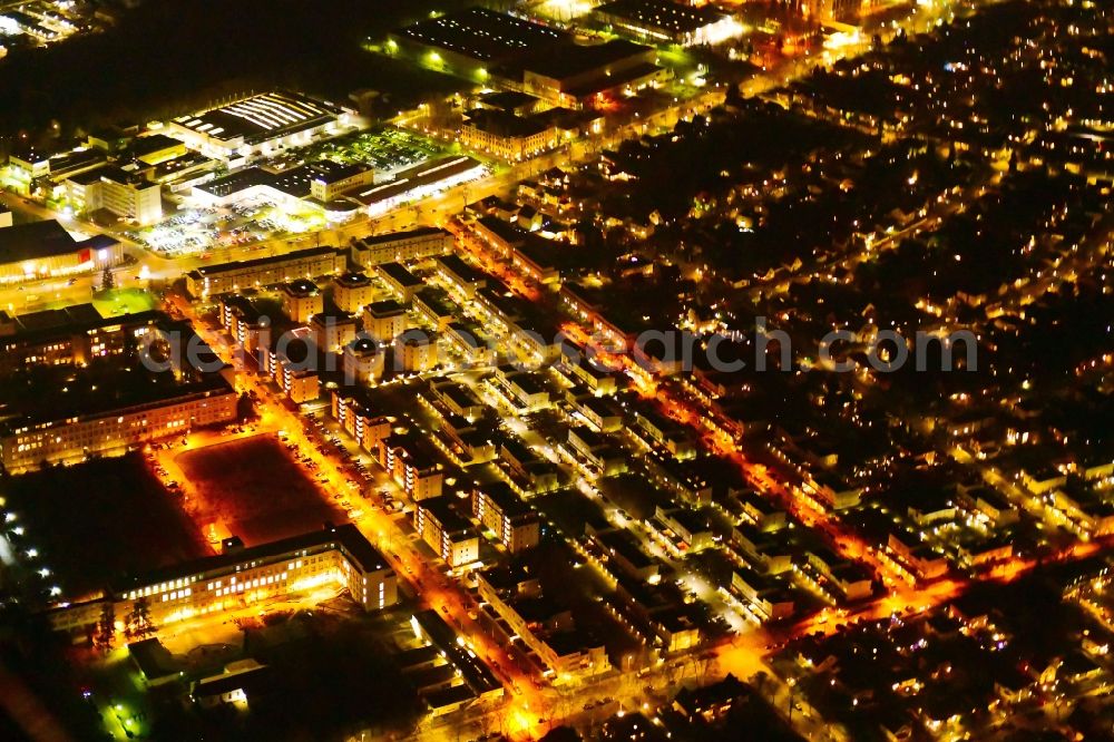 Aerial image at night Berlin - Night lighting residential area of the multi-family house settlement along the Harry-S.-Truman-Allee - William-H.-Tunner-Strasse in Berlin, Germany