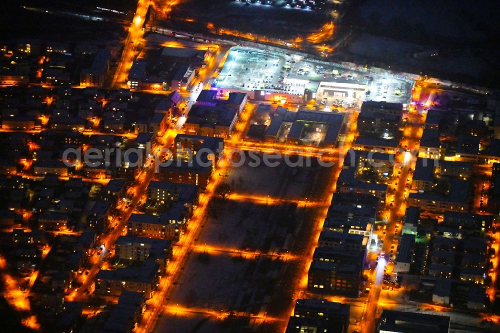 Lübeck at night from above - Night lighting residential area along the park Carlebach-Park in the district Strecknitz in Luebeck in the state Schleswig-Holstein, Germany