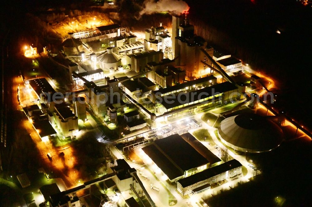 Rüdersdorf at night from the bird perspective: Night lighting cEMEX cement plant in Ruedersdorf in Brandenburg