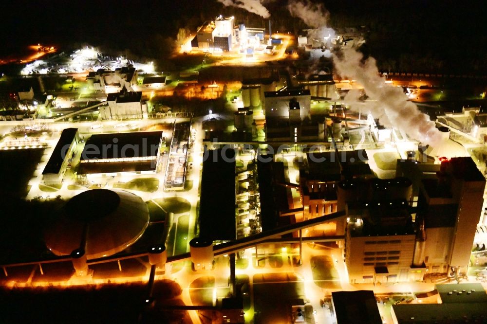 Rüdersdorf at night from the bird perspective: Night lighting cEMEX cement plant in Ruedersdorf in Brandenburg