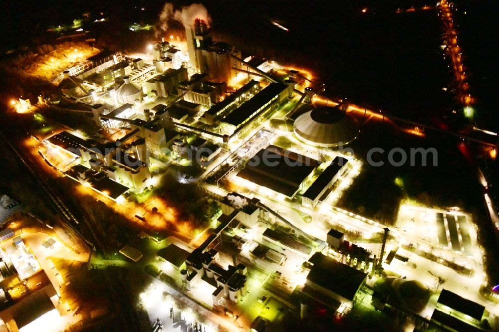 Rüdersdorf at night from the bird perspective: Night lighting cEMEX cement plant in Ruedersdorf in Brandenburg