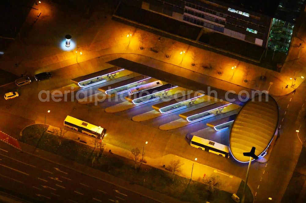 Aerial photograph at night Halle (Saale) - Night lighting Central Bus Station to OBS Omnibusbetrieb Saalekreis GmbH the Public Transportation in Halle (Saale) in the state Saxony-Anhalt, Germany