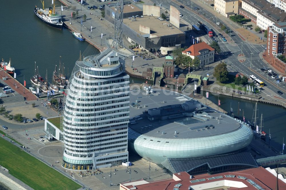 Bremerhaven from the bird's eye view: Atlantic Hotel Sail City and Klimahaus in Bremerhaven in the state of Bremen. The four star hotel with its bent front is located adjacent to the exhibition space of Klimahaus Bremerhaven 8° Ost and on the riverbank of the Weser