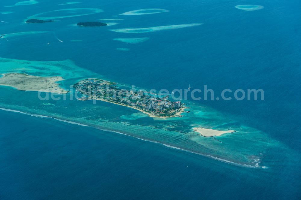 Maafushi from the bird's eye view: Atoll at the water surface Kaafu in the Indian Ocean in Maafushi in Kaafu Atoll, Maldives