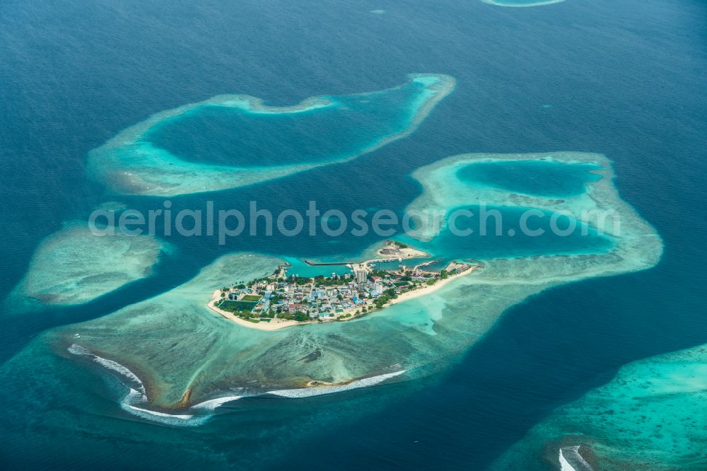 Aerial image Guraidhoo - Atoll on the water surface of the Laccadive Sea in the Indian Ocean on street Bodu Magu in Guraidhoo in Kaafu Atoll, Maldives