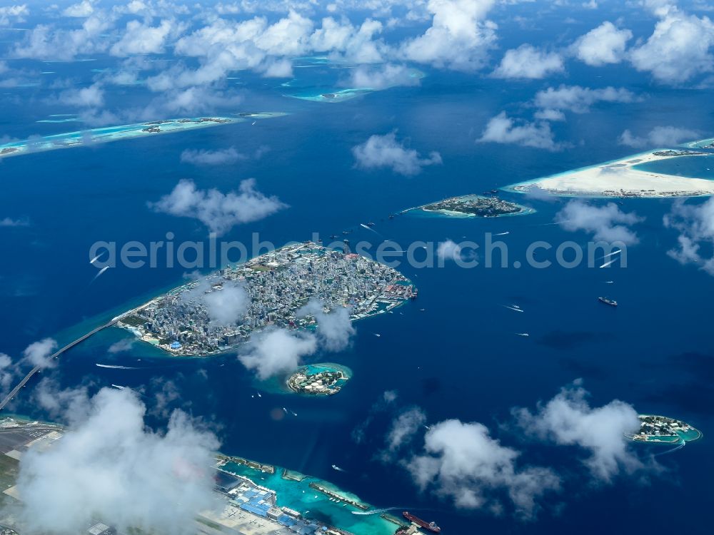 Aerial photograph Male - Atoll on the water surface Male on street Majeedhee Magu Road in Male in Maldives