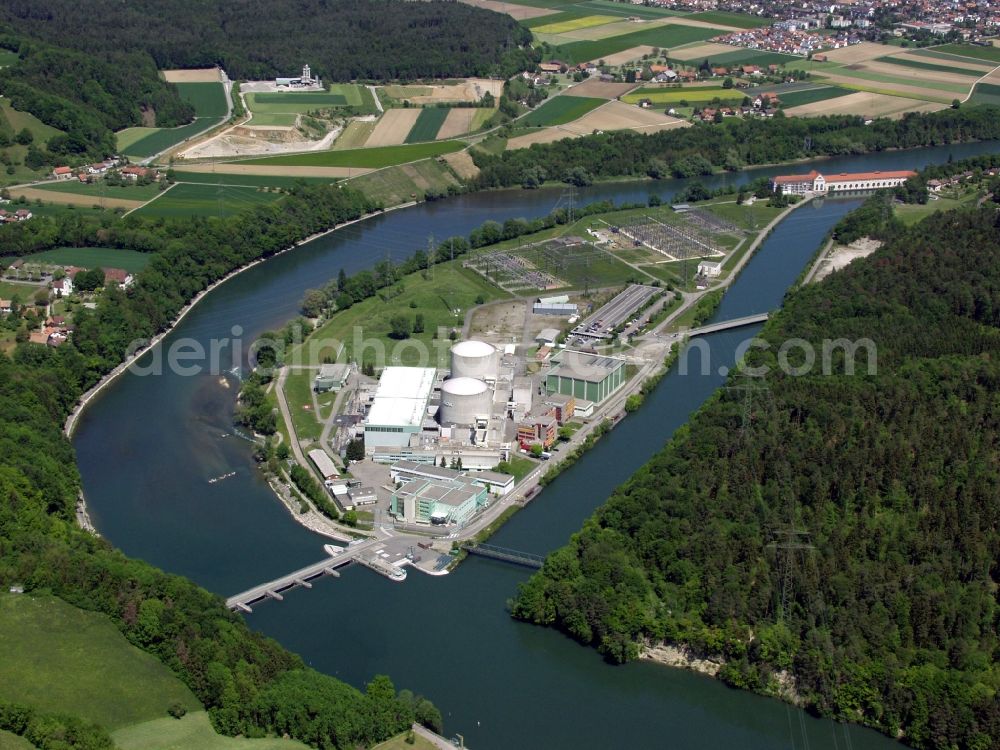 Döttingen from above - In Doettingen in Switzerland in the canton of Aargau, the Swiss nuclear power plant with the two pressurized water reactors of each 365 MW lies at the Aare river shortly before its confluence with the Rhine. Beznau-1 and Beznau-2 went into operation in 1969 and 1972. Beznau-1 is the first nuclear power plant in Switzerland and the oldest in the world. The nuclear reactor is currently under revision and gets new covers on the reactor pressure vessels