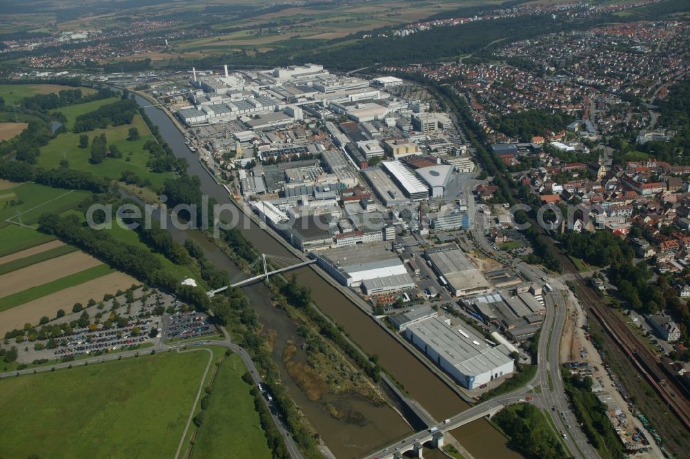 Neckarsulm from above - Branch of the Audi AG in Neckarsulm in the state Baden-Wuerttemberg. The factory is located directly at the bank of the river Neckar