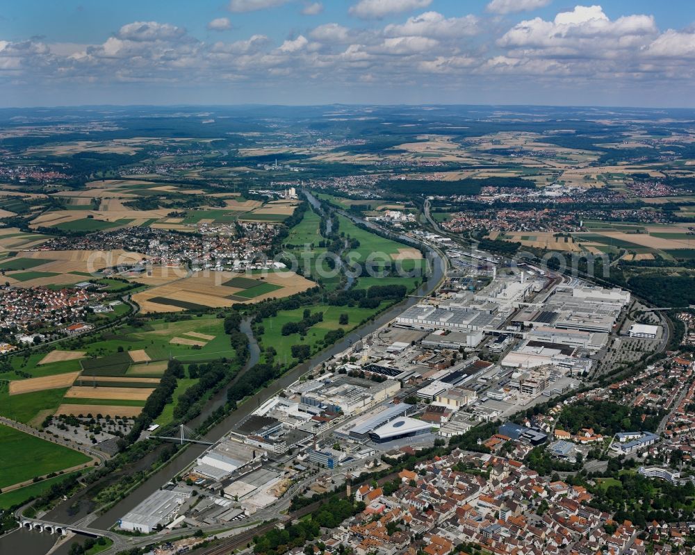 Aerial image Neckarsulm - Audi AG Works in Neckarsulm in the state of Baden-Wuerttemberg. The car production site goes back 100 years. The Audi factory is the second site of production of the car company next to Ingolstadt. The representative building Audi Forum can be seen on the Southern edge of the compound