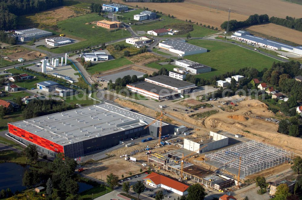 Aerial photograph GROßRÖHRSDORF - Blick auf den Auf- und Ausbau des Werksgeändes der SUNFILM AG an der Sunfilmstraße 8 in 01900 Großröhrsdorf (+49 35952 280-0, info@sunfilm.com). An diesem Standort laufen Bauarbeiten für die größte Produktionsstätte Sachsens zur Herstellung von Dünnschicht-Fotovoltaik-Modulen.