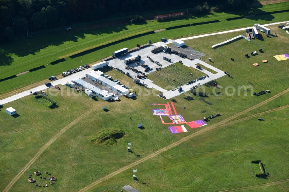 Aerial photograph Hoppegarten - Constructions to the music festival Lollapalooza at the Racetrack racecourse - trotting Rennbahn Hoppegarten GmbH & Co. KG on Goetheallee in Hoppegarten in the state Brandenburg, Germany