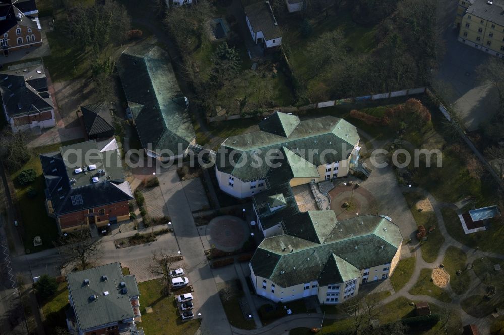 Aerial photograph Lutherstadt Wittenberg - The work of Augustine eV in Wittenberg in Saxony-Anhalt offers in the buildings in the Melanchtonstraße to secure and assisted living and working for people with intellectual and multiple disabilities. There are here housing units for different sized groups of people and labor and therapy rooms