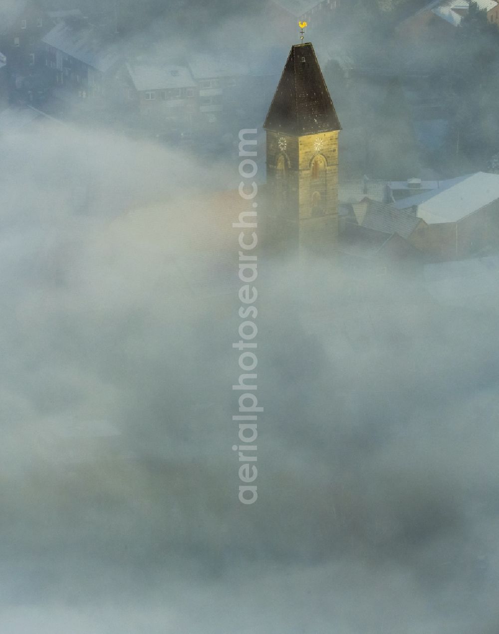 Aerial image Hamm - From the fog cloud cover outstanding spire of the Protestant Church in Paul Hamm in North Rhine-Westphalia