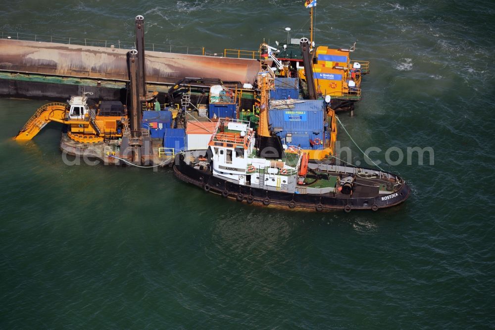 Aerial photograph Warnemünde - Dredging work on a route - fairway on the water surface of baltic sea in Warnemuende in the state Mecklenburg - Western Pomerania