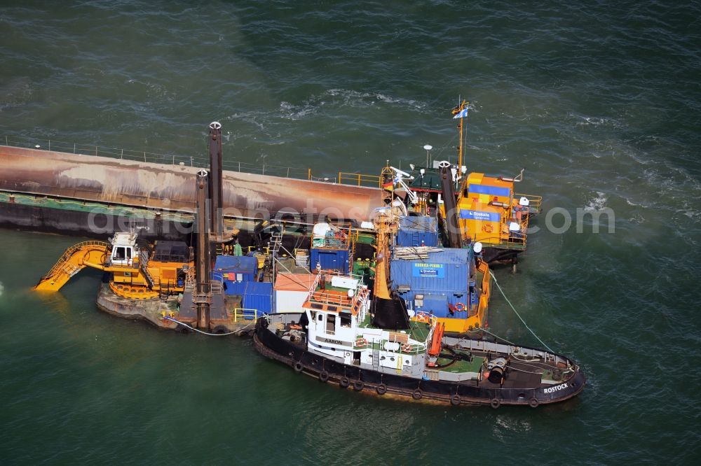 Warnemünde from above - Dredging work on a route - fairway on the water surface of baltic sea in Warnemuende in the state Mecklenburg - Western Pomerania