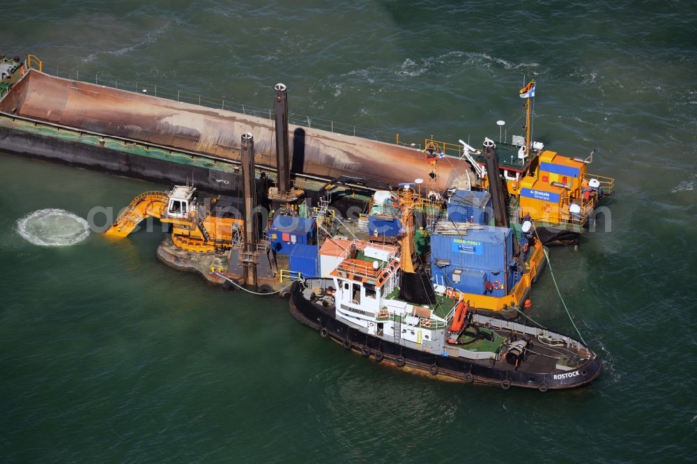 Aerial image Warnemünde - Dredging work on a route - fairway on the water surface of baltic sea in Warnemuende in the state Mecklenburg - Western Pomerania