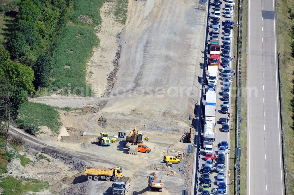 Dittersdorf from the bird's eye view: Buildings and route of the motorway A9 motorway with four lanes now. Currently, reconstruction, expansion and new construction work is underway for the six-lane expansion of Highway 9 between Triptis and Schleiz by Wayss & Freytag Ingenieurbau and EUROVIA VINCI