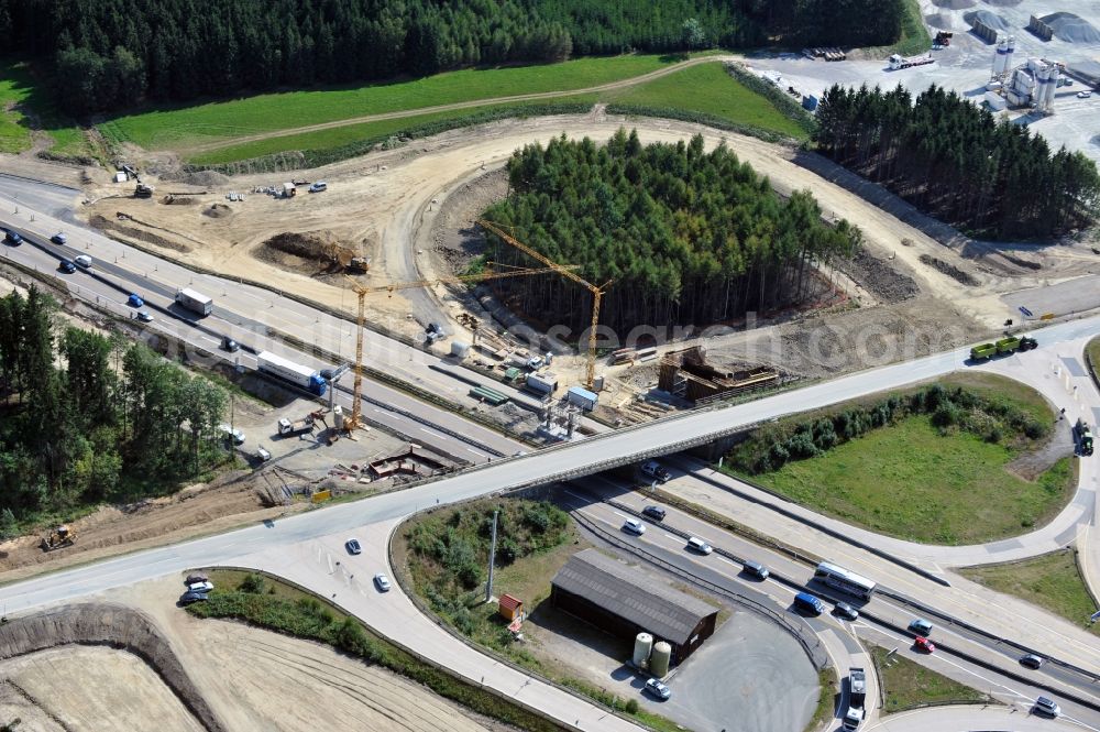 Dittersdorf from the bird's eye view: Buildings and route of the motorway A9 motorway with four lanes now. Currently, reconstruction, expansion and new construction work is underway for the six-lane expansion of Highway 9 between Triptis and Schleiz by Wayss & Freytag Ingenieurbau and EUROVIA VINCI