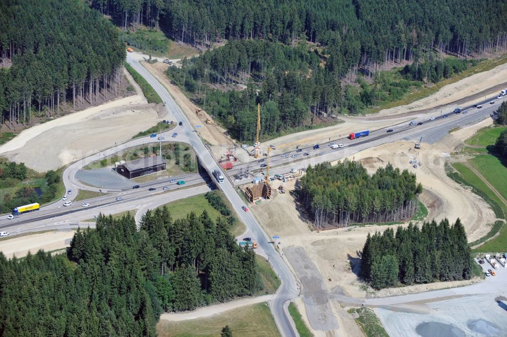 Dittersdorf from the bird's eye view: Buildings and route of the motorway A9 motorway with four lanes now. Currently, reconstruction, expansion and new construction work is underway for the six-lane expansion of Highway 9 between Triptis and Schleiz by Wayss & Freytag Ingenieurbau and EUROVIA VINCI