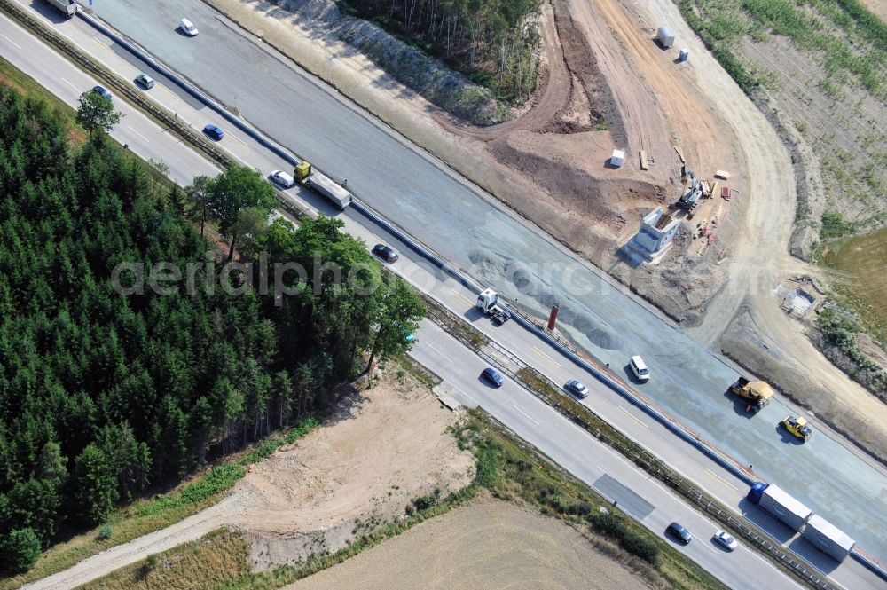 Dittersdorf from the bird's eye view: Buildings and route of the motorway A9 motorway with four lanes now. Currently, reconstruction, expansion and new construction work is underway for the six-lane expansion of Highway 9 between Triptis and Schleiz by Wayss & Freytag Ingenieurbau and EUROVIA VINCI