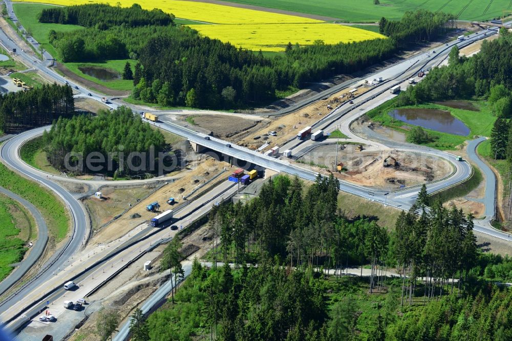 Dittersdorf from the bird's eye view: Buildings and route of the motorway A9 motorway with four lanes now. Currently, reconstruction, expansion and new construction work is underway for the six-lane expansion of Highway 9 between Triptis and Schleiz by Wayss & Freytag Ingenieurbau and EUROVIA VINCI