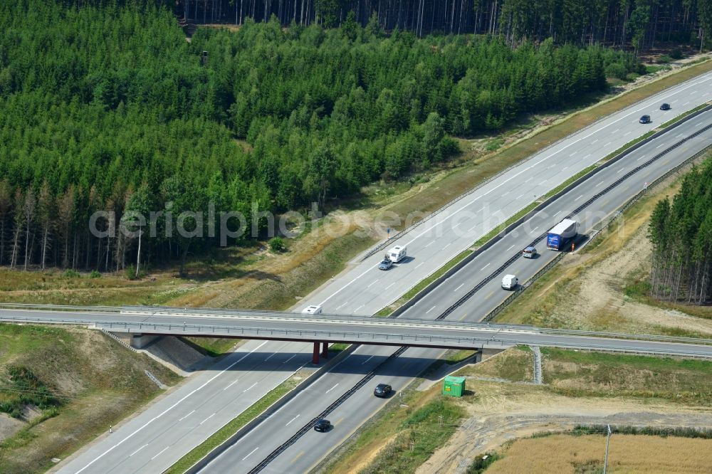 Dittersdorf from the bird's eye view: Buildings and route of the motorway A9 motorway with four lanes now. Currently, reconstruction, expansion and new construction work is underway for the six-lane expansion of Highway 9 between Triptis and Schleiz by Wayss & Freytag Ingenieurbau and EUROVIA VINCI