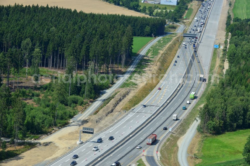 Dittersdorf from the bird's eye view: Buildings and route of the motorway A9 motorway with four lanes now. Currently, reconstruction, expansion and new construction work is underway for the six-lane expansion of Highway 9 between Triptis and Schleiz by Wayss & Freytag Ingenieurbau and EUROVIA VINCI