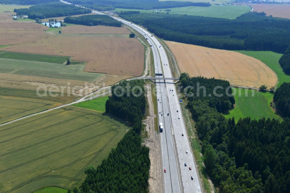 Dittersdorf from the bird's eye view: Buildings and route of the motorway A9 motorway with four lanes now. Currently, reconstruction, expansion and new construction work is underway for the six-lane expansion of Highway 9 between Triptis and Schleiz by Wayss & Freytag Ingenieurbau and EUROVIA VINCI