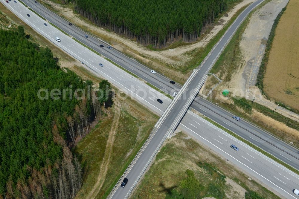 Dittersdorf from the bird's eye view: Buildings and route of the motorway A9 motorway with four lanes now. Currently, reconstruction, expansion and new construction work is underway for the six-lane expansion of Highway 9 between Triptis and Schleiz by Wayss & Freytag Ingenieurbau and EUROVIA VINCI