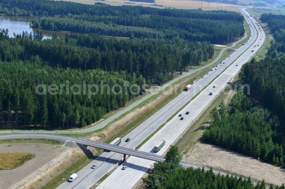 Dittersdorf from the bird's eye view: Buildings and route of the motorway A9 motorway with four lanes now. Currently, reconstruction, expansion and new construction work is underway for the six-lane expansion of Highway 9 between Triptis and Schleiz by Wayss & Freytag Ingenieurbau and EUROVIA VINCI