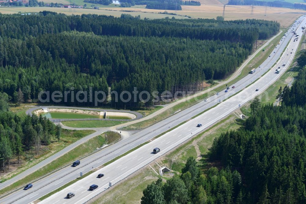 Dittersdorf from the bird's eye view: Buildings and route of the motorway A9 motorway with four lanes now. Currently, reconstruction, expansion and new construction work is underway for the six-lane expansion of Highway 9 between Triptis and Schleiz by Wayss & Freytag Ingenieurbau and EUROVIA VINCI