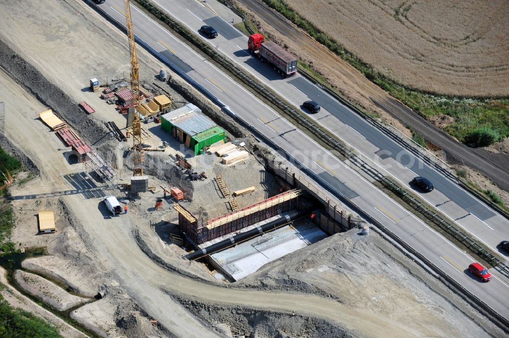 Aerial photograph Köthnitz - Buildings and route of the motorway A9 motorway with four lanes now. Currently, reconstruction, expansion and new construction work is underway for the six-lane expansion of Highway 9 between Triptis and Schleiz by Wayss & Freytag Ingenieurbau and EUROVIA VINCI in Thuringia