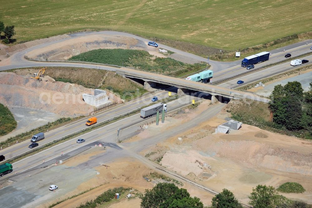 Aerial photograph Lemnitz - Buildings and route of the motorway A9 motorway with four lanes now. Currently, reconstruction, expansion and new construction work is underway for the six-lane expansion of Highway 9 between Triptis and Schleiz by Wayss & Freytag Ingenieurbau and EUROVIA VINCI in Thuringia