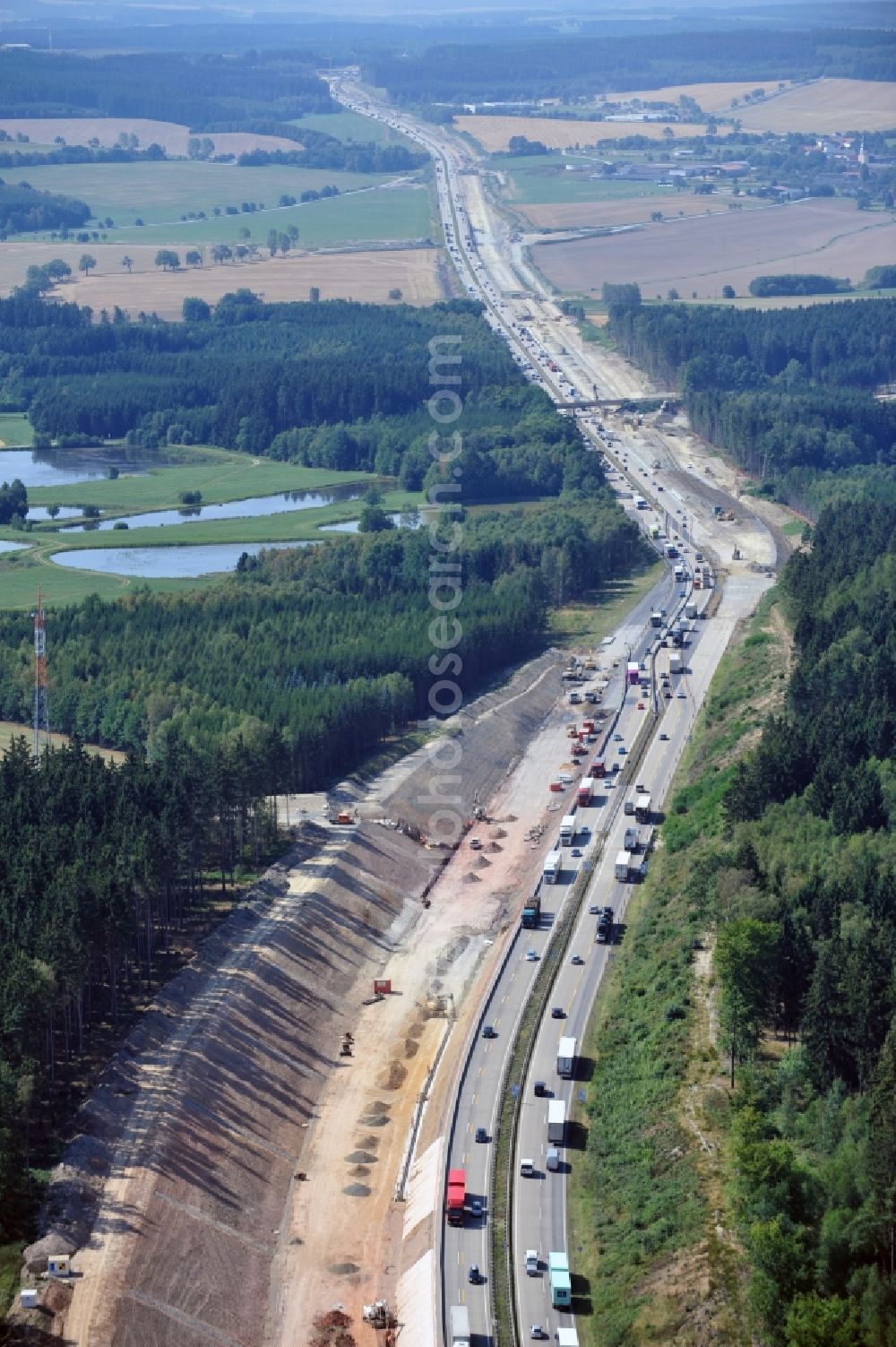 Lemnitz from above - Buildings and route of the motorway A9 motorway with four lanes now. Currently, reconstruction, expansion and new construction work is underway for the six-lane expansion of Highway 9 between Triptis and Schleiz by Wayss & Freytag Ingenieurbau and EUROVIA VINCI in Thuringia