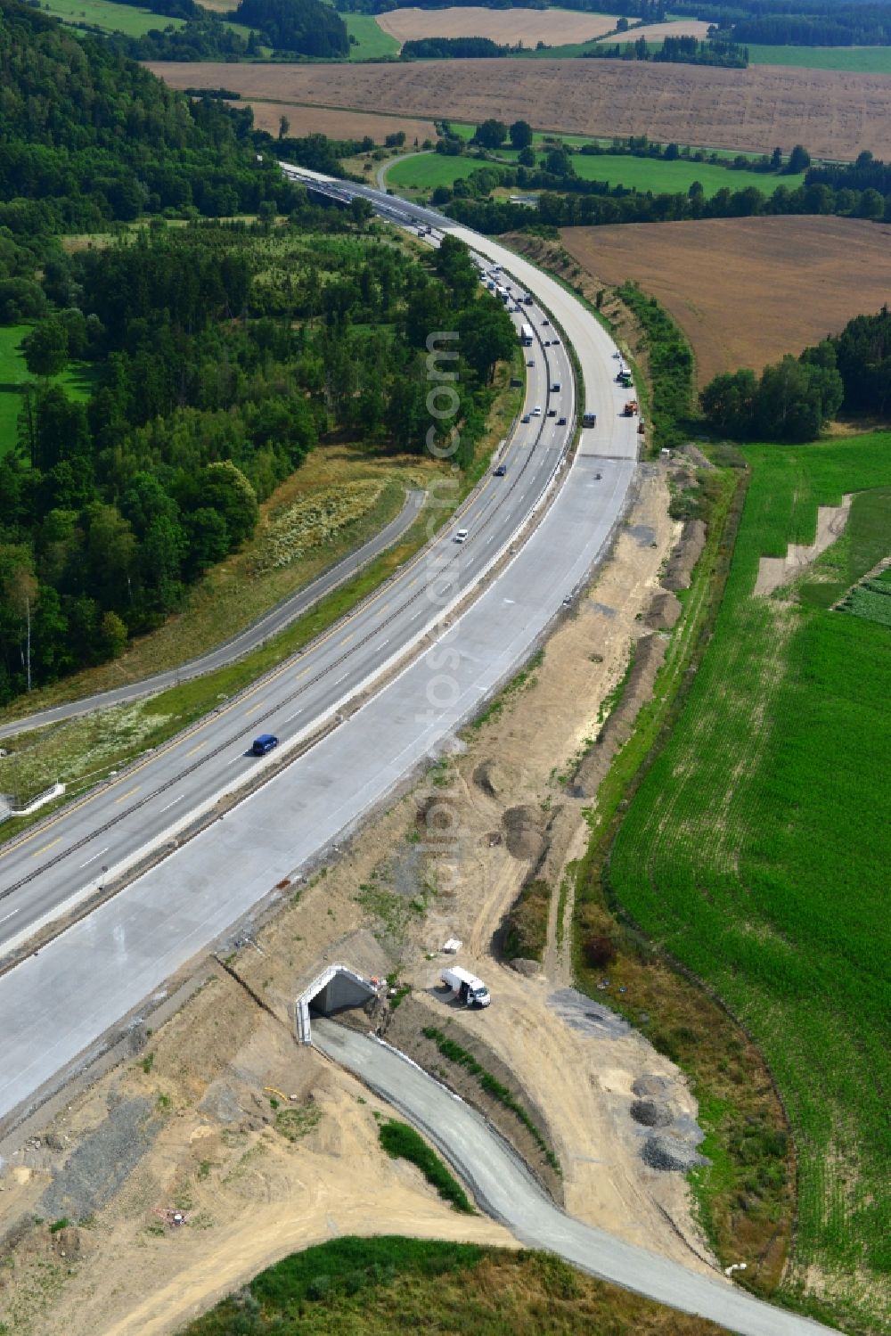 Mönchgrün from above - Buildings and route of the motorway A9 motorway with four lanes now. Currently, reconstruction, expansion and new construction work is underway for the six-lane expansion of Highway 9near Moenchgruen by Wayss & Freytag Ingenieurbau and EUROVIA VINCI in Thuringia