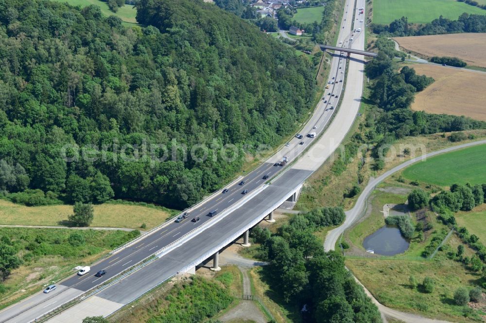 Aerial photograph Mönchgrün - Buildings and route of the motorway A9 motorway with four lanes now. Currently, reconstruction, expansion and new construction work is underway for the six-lane expansion of Highway 9near Moenchgruen by Wayss & Freytag Ingenieurbau and EUROVIA VINCI in Thuringia