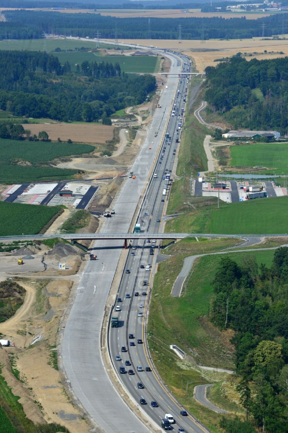 Mönchgrün from above - Buildings and route of the motorway A9 motorway with four lanes now. Currently, reconstruction, expansion and new construction work is underway for the six-lane expansion of Highway 9near Moenchgruen by Wayss & Freytag Ingenieurbau and EUROVIA VINCI in Thuringia