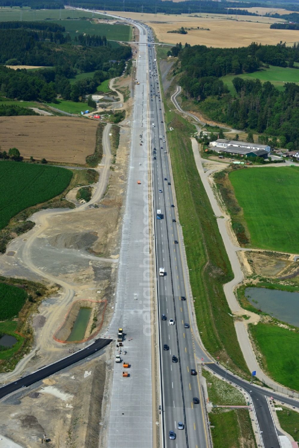 Mönchgrün from above - Buildings and route of the motorway A9 motorway with four lanes now. Currently, reconstruction, expansion and new construction work is underway for the six-lane expansion of Highway 9near Moenchgruen by Wayss & Freytag Ingenieurbau and EUROVIA VINCI in Thuringia