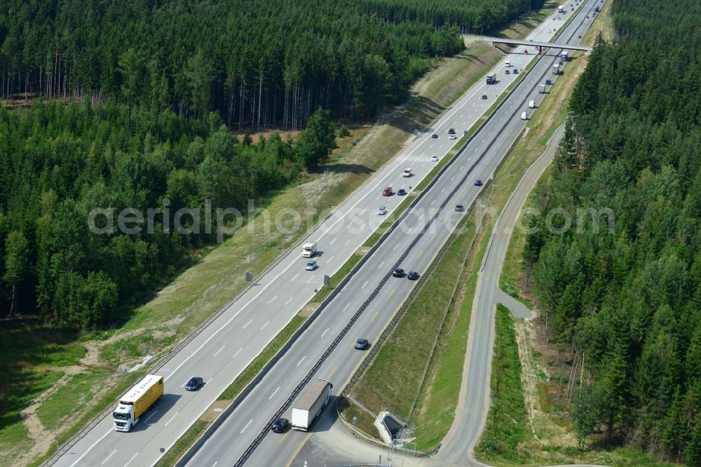 Pörmitz from above - Buildings and route of the motorway A9 motorway with four lanes now. Currently, reconstruction, expansion and new construction work is underway for the six-lane expansion of Highway 9 near Poermitz by Wayss & Freytag Ingenieurbau and EUROVIA VINCI in Thuringia