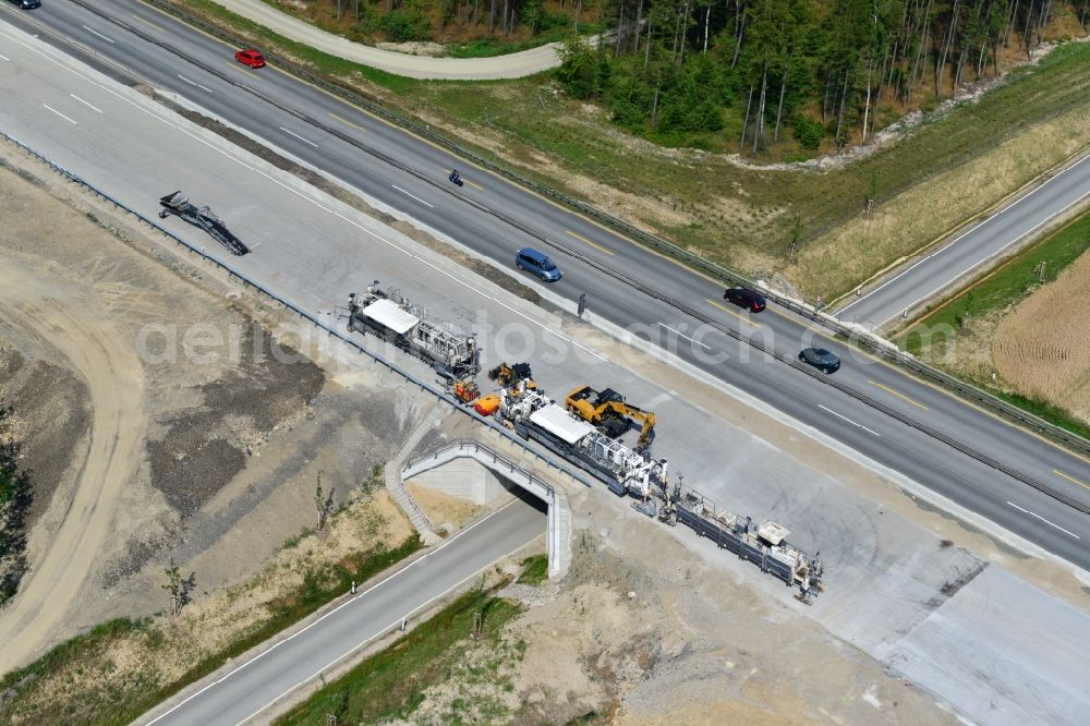 Pörmitz from the bird's eye view: Buildings and route of the motorway A9 motorway with four lanes now. Currently, reconstruction, expansion and new construction work is underway for the six-lane expansion of Highway 9 near Poermitz by Wayss & Freytag Ingenieurbau and EUROVIA VINCI in Thuringia