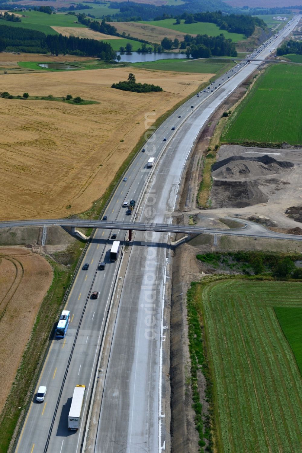 Aerial image Pörmitz - Buildings and route of the motorway A9 motorway with four lanes now. Currently, reconstruction, expansion and new construction work is underway for the six-lane expansion of Highway 9 near Poermitz by Wayss & Freytag Ingenieurbau and EUROVIA VINCI in Thuringia